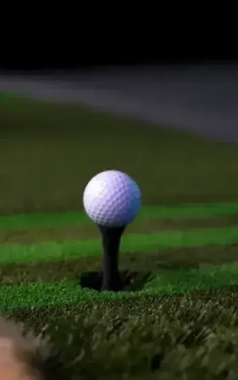 Golf ball automatically teed up